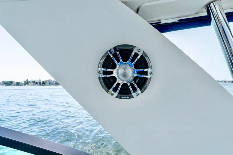 Slide: The Image of Speaker on 2020 Sea Ray Sundancer 320 boat, with water view in background. - 17