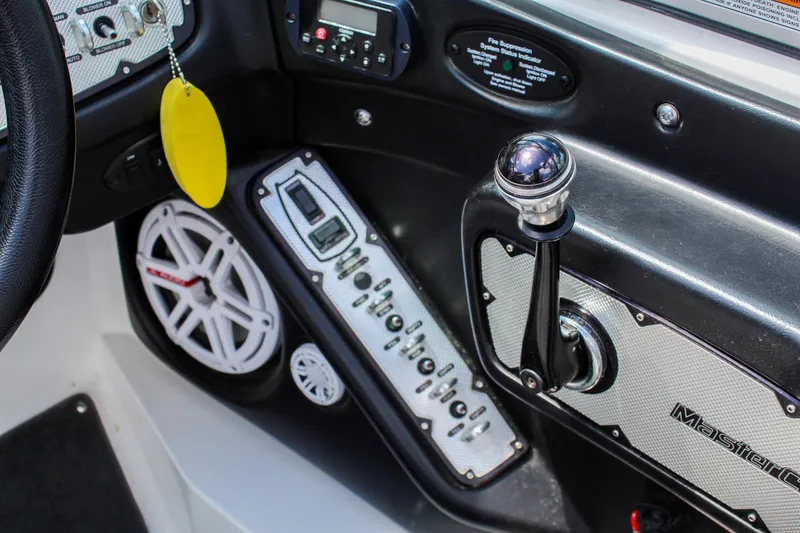 Slide: The Image of Interior of a 2010 MasterCraft X-15 boat showing control panel and audio system. - 13