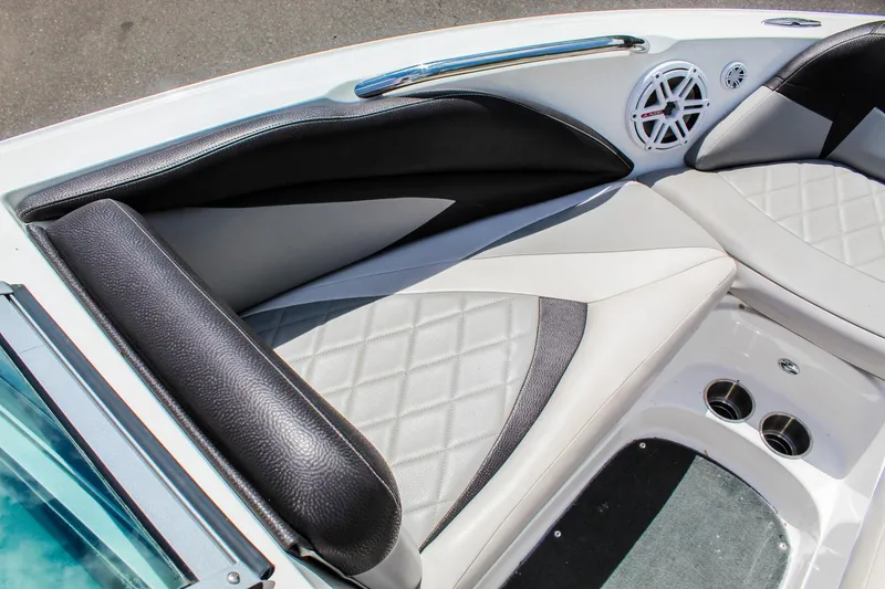 Slide: The Image of 2010 MasterCraft X-15 boat interior with black and white seating and speaker. - 17