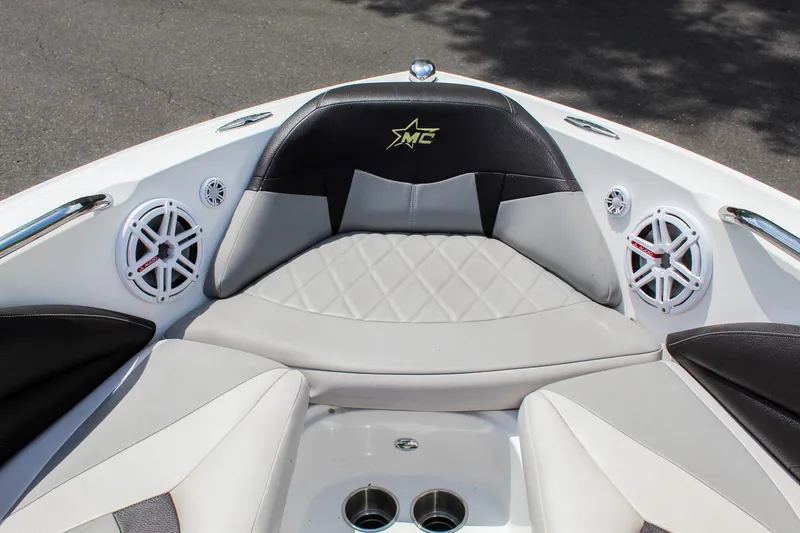 Slide: The Image of 2010 MasterCraft X-15 boat interior with cushioned seating and speakers. - 18