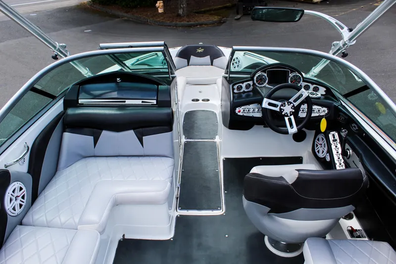 Slide: The Image of 2010 MasterCraft X-15 boat interior with sleek seating and modern dashboard. - 22