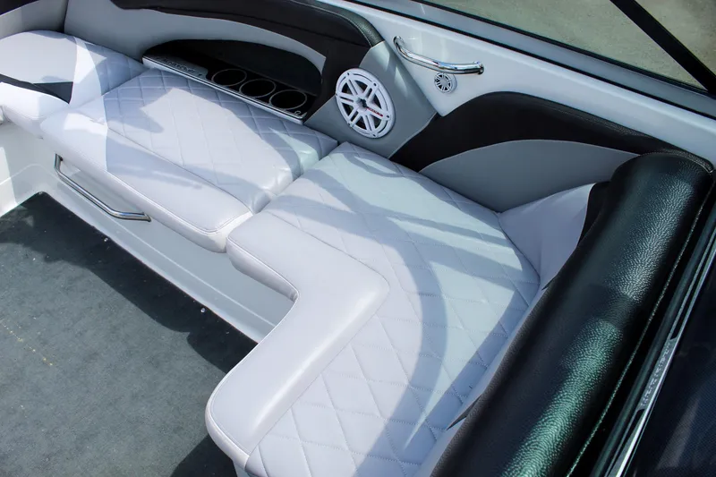 Slide: The Image of 2010 MasterCraft X-15 boat interior with white seating and speaker. - 23