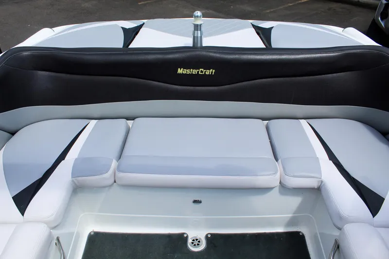 Slide: The Image of 2010 MasterCraft X-15 boat interior with cushioned seating and sleek design. - 27