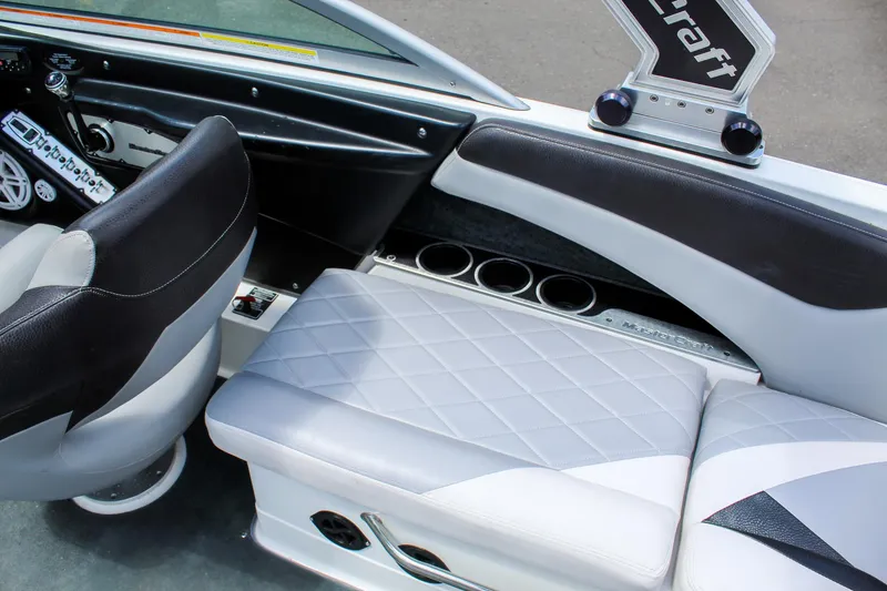 Slide: The Image of 2010 MasterCraft X-15 interior with quilted seating and cup holders. - 29