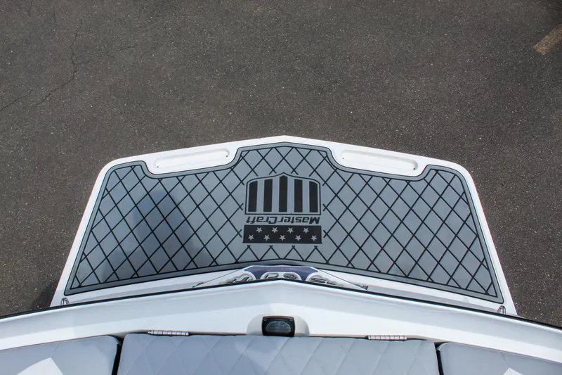 Slide: The Image of 2010 MasterCraft X-15 boat swim platform with logo and diamond pattern design. - 31