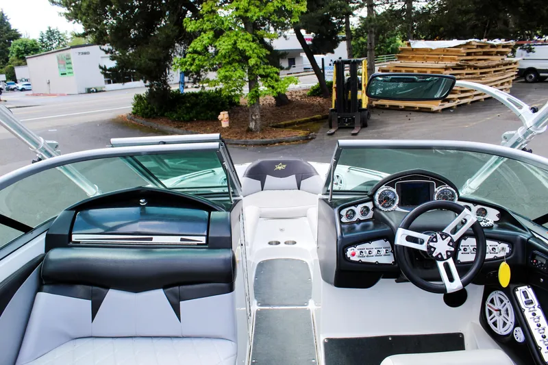 Slide: The Image of 2010 MasterCraft X-15 boat interior with modern dashboard and seating. - 36