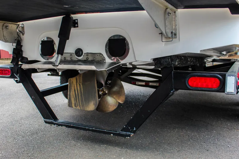 Slide: The Image of Rear view of 2010 MasterCraft X-15 boat on trailer, showing propeller and exhaust. - 40