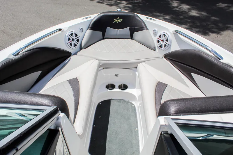 Slide: The Image of 2010 MasterCraft X-15 boat interior with sleek seating and cup holders. - 9