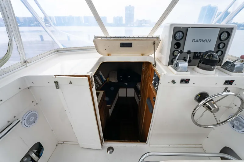 Slide: The Image of Cockpit view of a 1978 Topaz 28 boat with Garmin navigation system. - 15