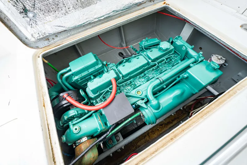 Slide: The Image of Engine compartment of a 1978 Topaz 28 boat, showcasing a well-maintained marine engine. - 22