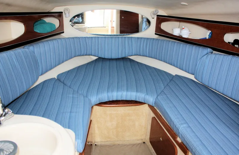 Slide: The Image of Interior cabin of 2003 Sea Ray 260 Sundancer with blue striped upholstery. - 15