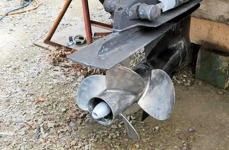 Slide: The Image of Propeller of a 2003 Sea Ray 260 Sundancer boat on gravel surface. - 29