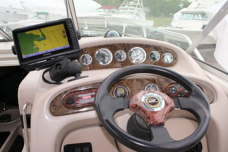 Slide: The Image of Dashboard of a 2003 Sea Ray 260 Sundancer with GPS and gauges. - 8