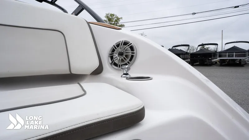 Slide: The Image of 2014 Yamaha Boats 242 Limited S interior with speaker and cup holder at Long Lake Marina. - 11