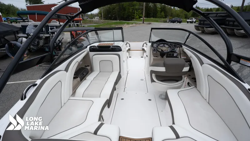 Slide: The Image of 2014 Yamaha Boats 242 Limited S interior with seating and helm at Long Lake Marina. - 12