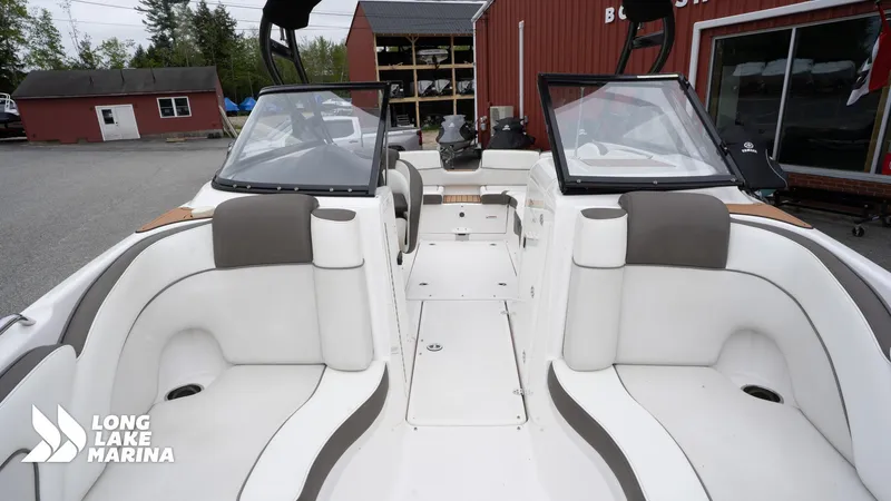 Slide: The Image of 2014 Yamaha Boats 242 Limited S interior at Long Lake Marina, featuring spacious seating and modern design. - 13