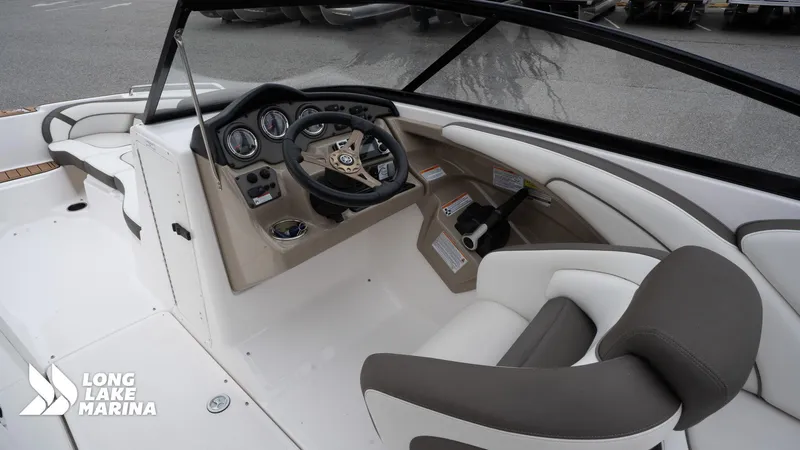 Slide: The Image of 2014 Yamaha Boats 242 Limited S interior with steering wheel and seating at Long Lake Marina. - 17