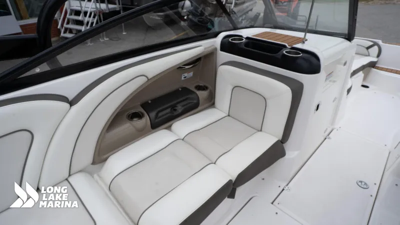 Slide: The Image of 2014 Yamaha Boats 242 Limited S interior with white seating and cup holders. - 18