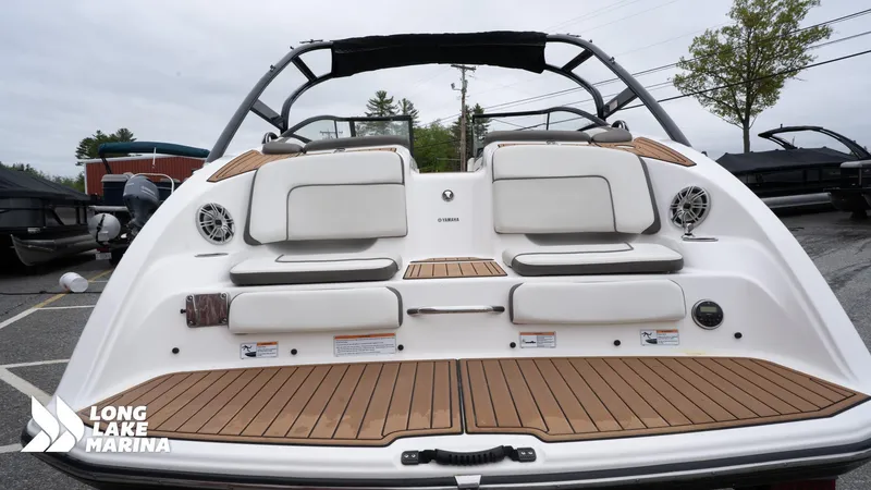 Slide: The Image of 2014 Yamaha Boats 242 Limited S with teak deck and cushioned seating at Long Lake Marina. - 9