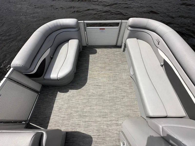 Slide: The Image of 2020 Bennington S 20 SLL pontoon boat interior with spacious seating and gray upholstery. - 7