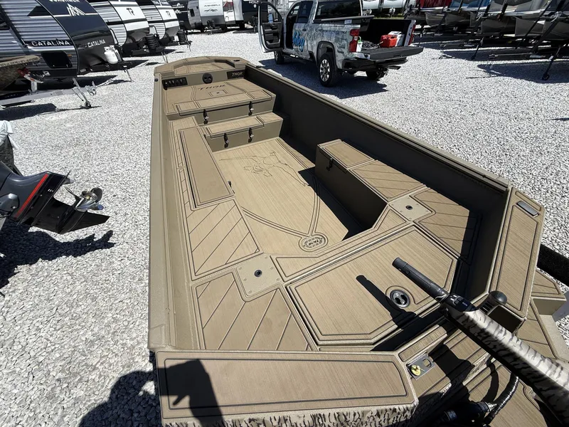 Slide: The Image of 2025 Thor Lake Hammer 1754 Timber Hammer boat in a gravel lot, surrounded by trailers. - 3