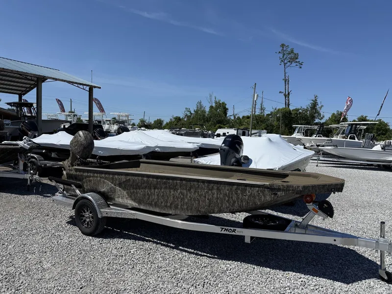 Slide: The Image of 2025 Thor Lake Hammer 1754 TIMBER HAMMER boat on trailer in outdoor lot. - 1