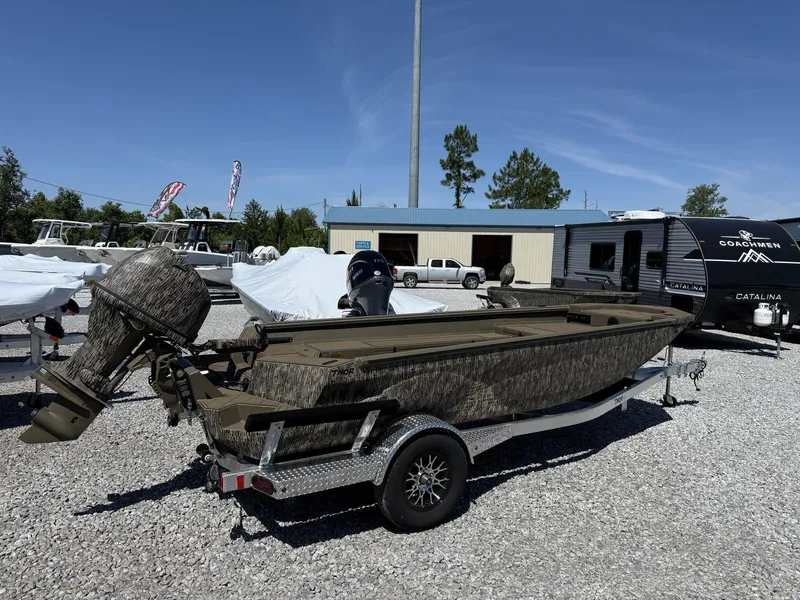 Slide: The Image of 2025 Thor Lake Hammer 1754 TIMBER HAMMER boat on trailer in outdoor lot. - 2