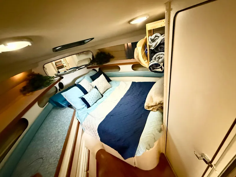 Slide: The Image of Cozy interior cabin of 1988 Carver Montego 3257 with bed and storage. - 37
