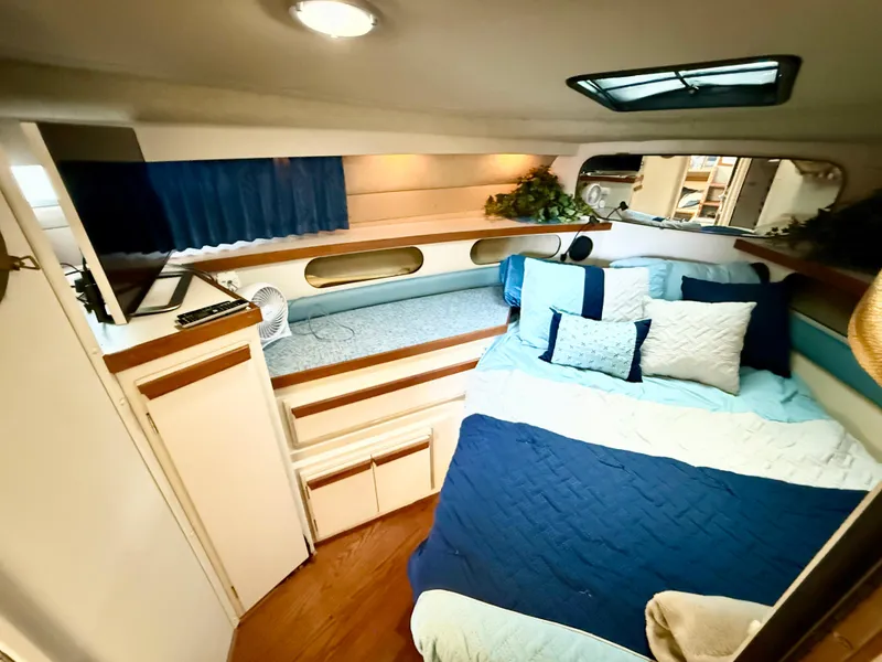 Slide: The Image of 1988 Carver Montego 3257 cabin interior with cozy bed and modern decor. - 38