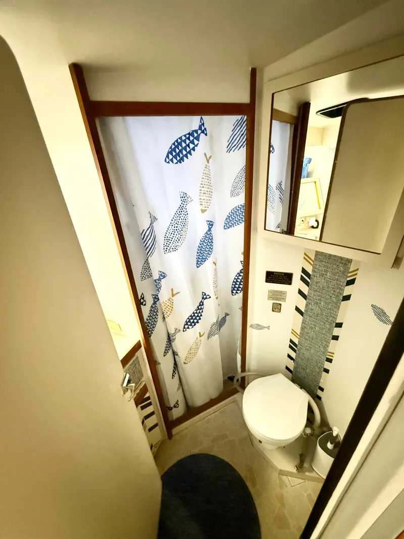 Slide: The Image of Bathroom interior of 1988 Carver Montego 3257 with fish-patterned shower curtain. - 40