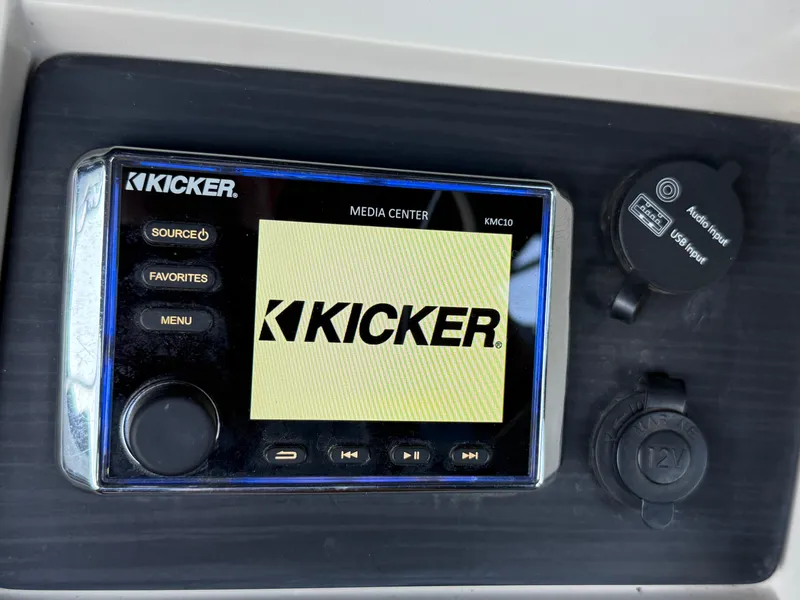 Slide: The Image of Kicker media center in 2019 Bennington SX 25 Premium Swingback boat dashboard. - 13