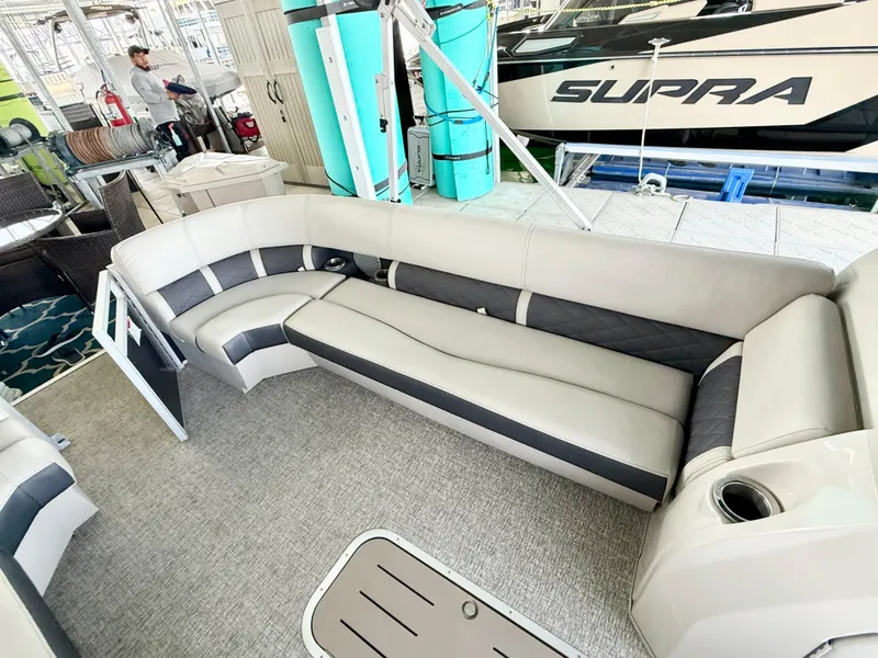 Slide: The Image of 2019 Bennington SX 25 Premium Swingback interior with spacious seating and modern design. - 18