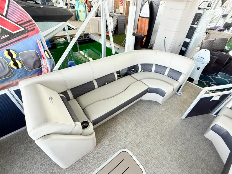 Slide: The Image of 2019 Bennington SX 25 Premium Swingback boat interior with plush seating and modern design. - 19