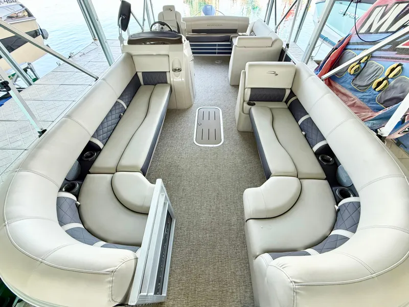 Slide: The Image of 2019 Bennington SX 25 Premium Swingback interior with spacious seating and modern design. - 7