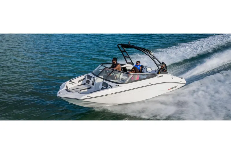 Slide: The Image of 2025 Yamaha AR195 boat cruising on open water with passengers enjoying the ride. - 10