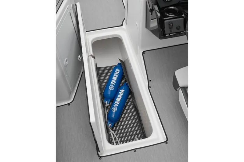 Slide: The Image of 2025 Yamaha AR195 boat storage compartment with Yamaha-branded blue fenders. - 5