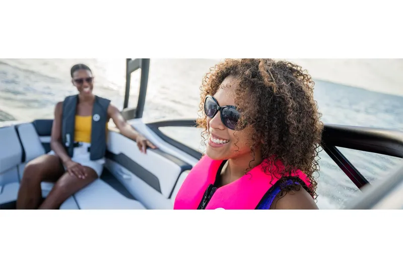 Slide: The Image of Two people enjoying a ride on a 2025 Yamaha AR195 boat. - 8