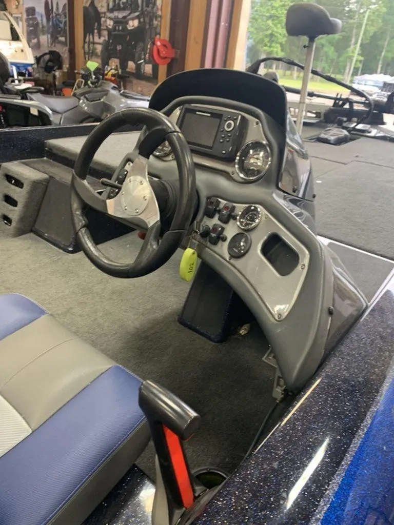 Slide: The Image of 2020 Skeeter ZX190 boat cockpit with steering wheel and control panel. - 2