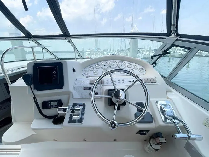 Slide: The Image of 1998 Cruisers Yachts 3375 Esprit helm with steering wheel and control panel. - 10
