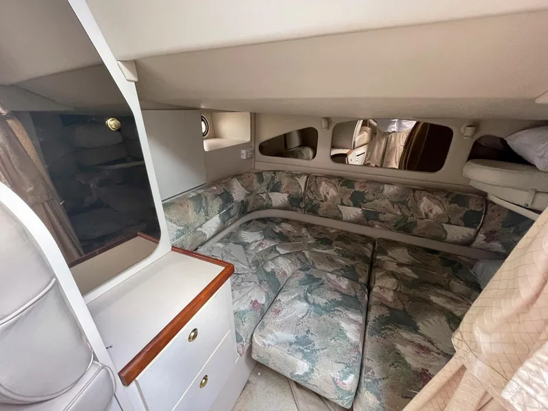 Slide: The Image of 1998 Cruisers Yachts 3375 Esprit cabin interior with floral upholstery and storage cabinets. - 12