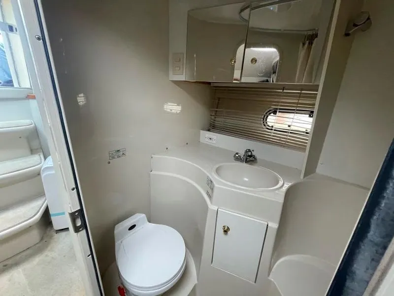 Slide: The Image of Bathroom interior of 1998 Cruisers Yachts 3375 Esprit with sink, toilet, and mirror. - 15