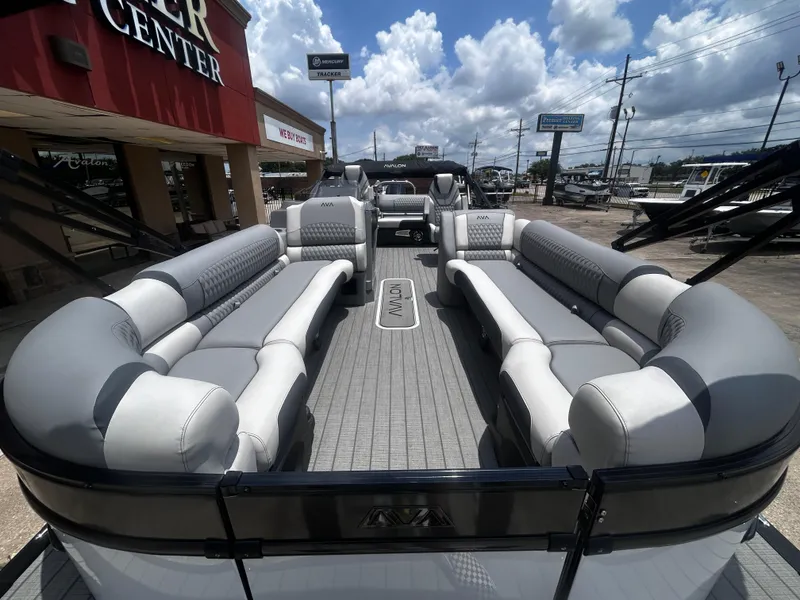 Slide: The Image of Luxurious 2025 Avalon CAT VRB25T pontoon boat with spacious seating, displayed outdoors. - 11