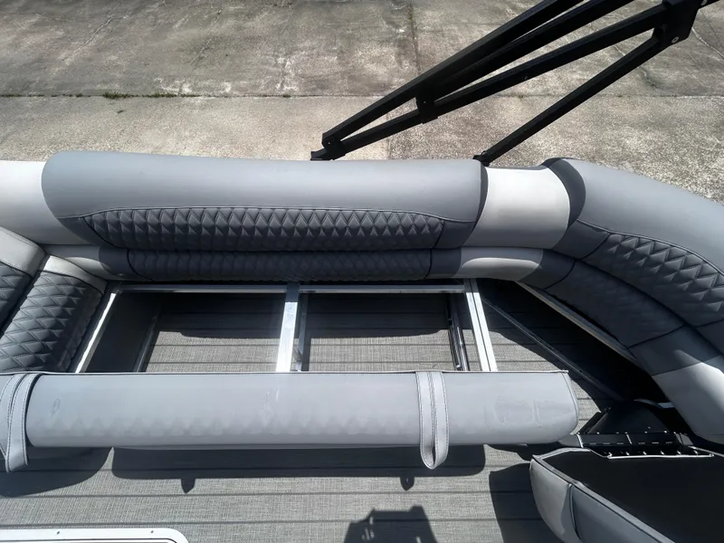 Slide: The Image of 2025 Avalon CAT VRB25T boat interior with gray cushioned seating and metal frame. - 15
