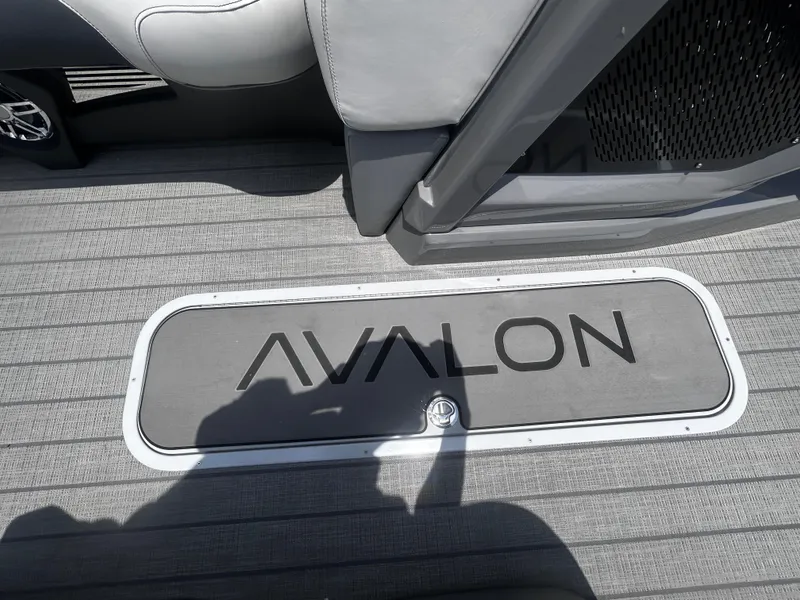 Slide: The Image of 2025 Avalon CAT VRB25T boat interior with logo on gray flooring. - 16