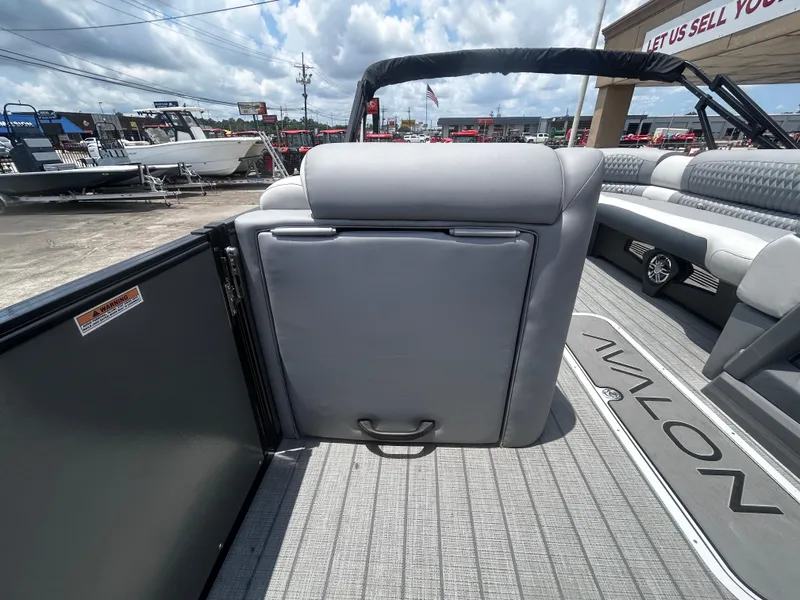 Slide: The Image of Interior of 2025 Avalon CAT VRB25T boat with gray seating and deck. - 19