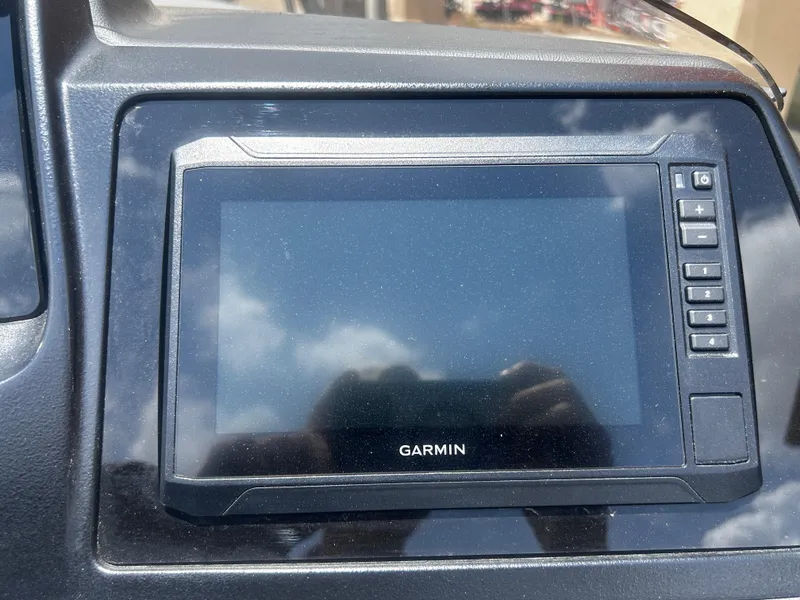 Slide: The Image of Garmin display screen in Avalon CAT VRB25T, 2025 model, reflecting sky and clouds. - 25
