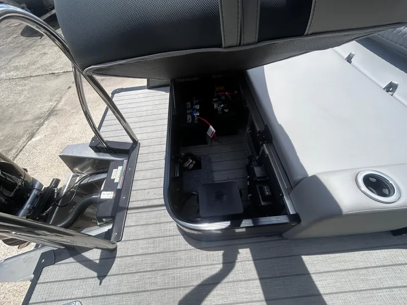 Slide: The Image of Avalon CAT VRB25T 2025 boat interior showing storage compartment and seating area. - 31