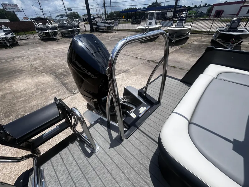 Slide: The Image of 2025 Avalon CAT VRB25T boat with Mercury engine, docked in a marina. - 32