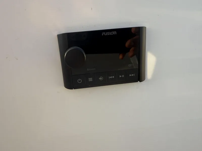 Slide: The Image of Control panel on a 2022 Hurricane SS205 boat, featuring a Fusion audio system. - 15