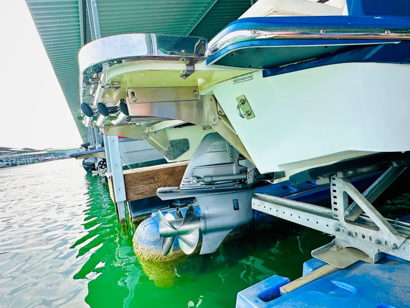 Slide: The Image of 2012 Cobalt A28 boat stern and propeller in marina water. - 20